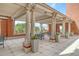 Relaxing patio area with seating and pergola at 150 Bee St # 318, Charleston, SC 29401