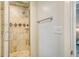 Clean shower with tile surround and glass door at 150 Bee St # 318, Charleston, SC 29401