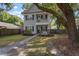 Gray house with walkway, landscaping, and large tree in front at 1617 Jessamine Rd, Charleston, SC 29407