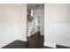 Bright hallway with hardwood floors and staircase leading upstairs at 1617 Jessamine Rd, Charleston, SC 29407