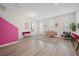 Open basement area with pink wall and stylish furniture at 1669 Indy Dr, North Charleston, SC 29405