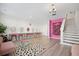 Finished basement with stylish pink accent wall and vanity area at 1669 Indy Dr, North Charleston, SC 29405