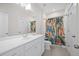 Clean bathroom with white vanity and patterned shower curtain at 1669 Indy Dr, North Charleston, SC 29405