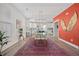 Open concept dining area features a glass table and pink rug at 1669 Indy Dr, North Charleston, SC 29405