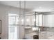 Modern kitchen island light fixture with glass panels at 1669 Indy Dr, North Charleston, SC 29405