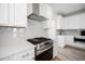 Modern kitchen features stainless steel appliances and white cabinets at 1669 Indy Dr, North Charleston, SC 29405