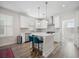 Modern white kitchen with an island and stainless steel appliances at 1669 Indy Dr, North Charleston, SC 29405