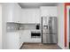 Corner kitchen with stainless steel appliances and white cabinets at 1669 Indy Dr, North Charleston, SC 29405
