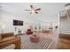 Open living room with modern furnishings and a view of the kitchen and dining area at 1669 Indy Dr, North Charleston, SC 29405
