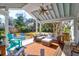 Relaxing back porch with seating area, ceiling fan, and backyard view at 1731 Houghton Dr, Charleston, SC 29412