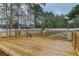 Wooden deck overlooking a pond with surrounding trees at 188 Midland Pkwy # 205, Summerville, SC 29485