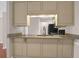 Tan kitchen cabinets, granite counters and black appliances at 188 Midland Pkwy # 205, Summerville, SC 29485