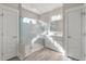 This bathroom features a glass shower with a seat and a vanity with cabinets and drawers at 200 Clearblue Loop, Summerville, SC 29486