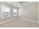 This bedroom offers neutral walls, a ceiling fan, and large windows for plenty of natural light at 200 Clearblue Loop, Summerville, SC 29486