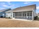 Spacious screened porch with seating and ceiling fan at 2015 Barn Swallow Rd, Summerville, SC 29483