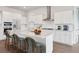 Island kitchen with white cabinets, quartz countertops and stainless steel appliances at 206 Denham St, Summerville, SC 29486