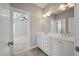 Double vanity bathroom with white cabinets and a large mirror at 2084 Amenity Park Dr, Mount Pleasant, SC 29466