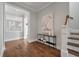 Elegant hallway showcasing hardwood floors and a statement art piece at 2084 Amenity Park Dr, Mount Pleasant, SC 29466