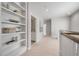 Upstairs hallway with built-in shelving and access to a small bathroom at 2084 Amenity Park Dr, Mount Pleasant, SC 29466