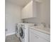 Bright laundry room with washer, dryer, and utility sink at 2084 Amenity Park Dr, Mount Pleasant, SC 29466
