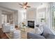 Living room with hardwood floors, fireplace, and ample natural light at 2084 Amenity Park Dr, Mount Pleasant, SC 29466