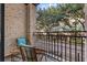 Private balcony with wicker chairs, offering a relaxing outdoor space at 21 George St # 114, Charleston, SC 29401