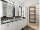 Elegant bathroom with double vanity and large mirror at 21 George St # 114, Charleston, SC 29401