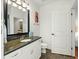 Well-appointed bathroom with granite countertop and a toilet at 21 George St # 114, Charleston, SC 29401