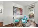 Small dining area with glass table and blue velvet chairs at 21 George St # 114, Charleston, SC 29401