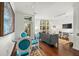 Small dining area with glass table and blue velvet chairs at 21 George St # 114, Charleston, SC 29401