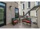 Private patio with wicker furniture, great for outdoor relaxation at 21 George St # 114, Charleston, SC 29401