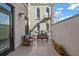 Private patio with wicker furniture, offering a relaxing outdoor space at 21 George St # 114, Charleston, SC 29401