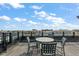 Relaxing rooftop deck with city views and outdoor furniture at 21 George St # 114, Charleston, SC 29401