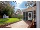 Brick patio, screened porch, and expansive grassy yard at 212 Thomaston Ave, Summerville, SC 29485