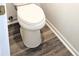 Clean powder room with wood-look flooring at 212 Thomaston Ave, Summerville, SC 29485