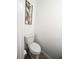 Clean bathroom with white toilet and decorative wall art at 212 Thomaston Ave, Summerville, SC 29485