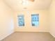 Bright bedroom with two windows and neutral decor at 212 Thomaston Ave, Summerville, SC 29485