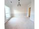 Simple dining room with neutral walls, carpeting, and a large window at 212 Thomaston Ave, Summerville, SC 29485