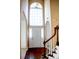 Bright entryway with hardwood floors, a staircase, and a large window at 212 Thomaston Ave, Summerville, SC 29485