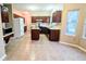 Well-lit kitchen with dark wood cabinets and ample counter space at 212 Thomaston Ave, Summerville, SC 29485