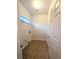 Laundry room with tile flooring and built-in shelving at 212 Thomaston Ave, Summerville, SC 29485