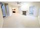 Open living room with a view of the kitchen and fireplace at 212 Thomaston Ave, Summerville, SC 29485