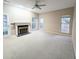 Living room with fireplace, carpet, and sliding glass doors at 212 Thomaston Ave, Summerville, SC 29485