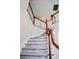 Elegant curved staircase with wood railings and carpet at 212 Thomaston Ave, Summerville, SC 29485