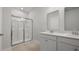 Bathroom with double vanity, framed mirrors, and glass-enclosed shower at 215 Terrace View Dr, Summerville, SC 29486