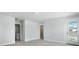A carpeted bedroom features a doorway to the bathroom, a walk-in closet and a glass door leading to a balcony at 215 Terrace View Dr, Summerville, SC 29486