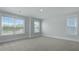 Bright bedroom with three windows providing ample natural light and plush carpeting for comfort at 215 Terrace View Dr, Summerville, SC 29486