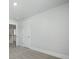 Bedroom features neutral carpet, white trim and an open doorway to staircase at 215 Terrace View Dr, Summerville, SC 29486