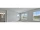A carpeted bedroom features a doorway to the bathroom and a glass door leading to a balcony at 215 Terrace View Dr, Summerville, SC 29486