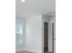 A bedroom features a window for natural light and a walk-in closet with shelving for organization at 215 Terrace View Dr, Summerville, SC 29486